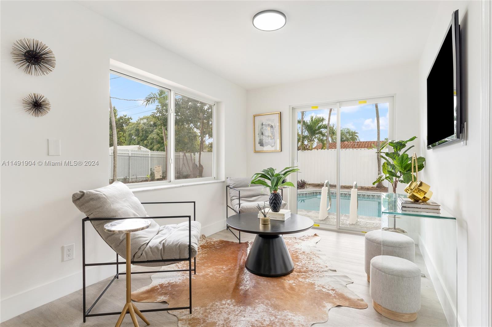 3254 Lincoln Street Hollywood, FL 33021 - Photo 17 of 27 a dining room with furniture and a potted plant