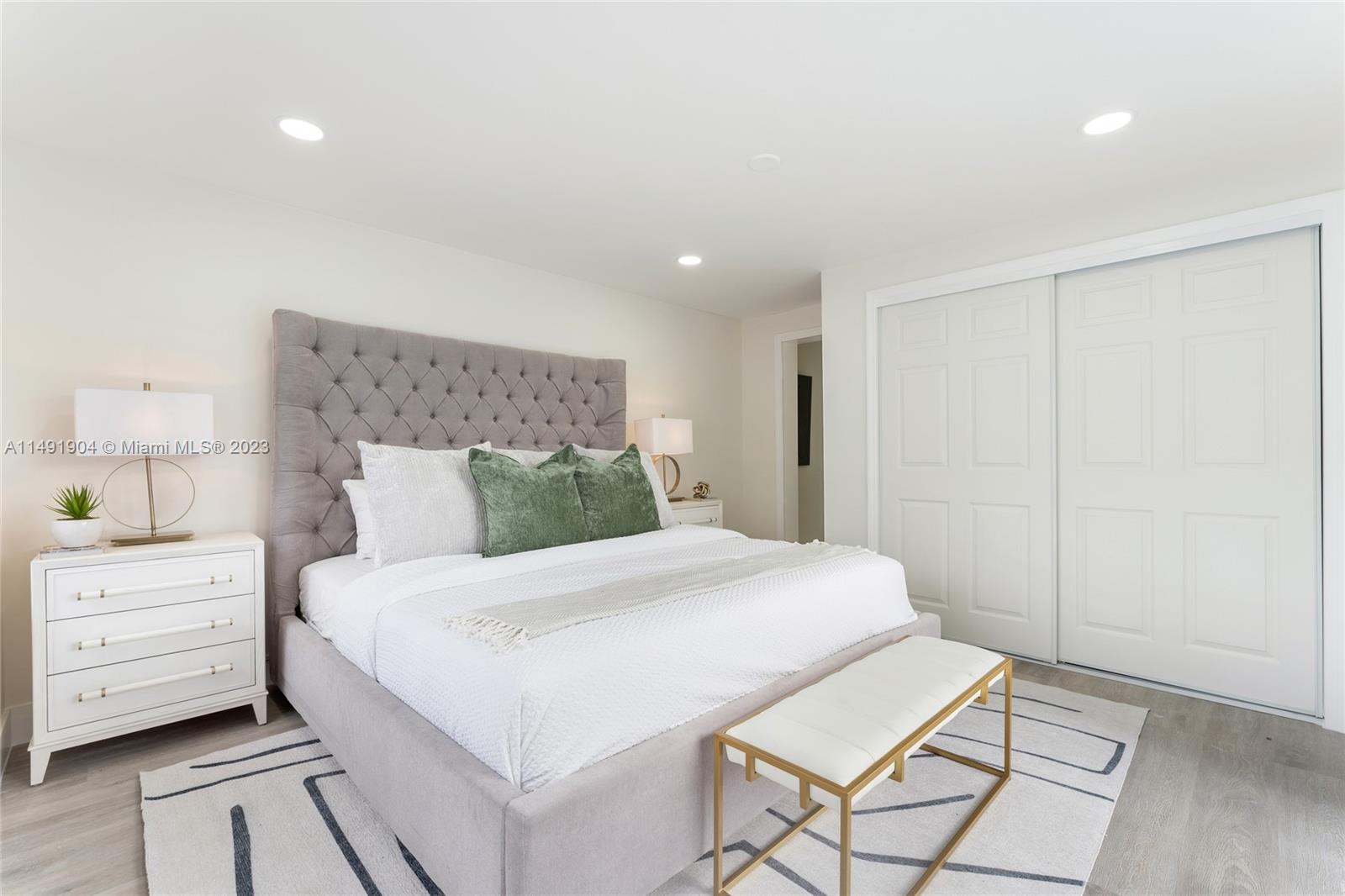3254 Lincoln Street Hollywood, FL 33021 - Photo 19 of 27 a bedroom with a bed and a dresser