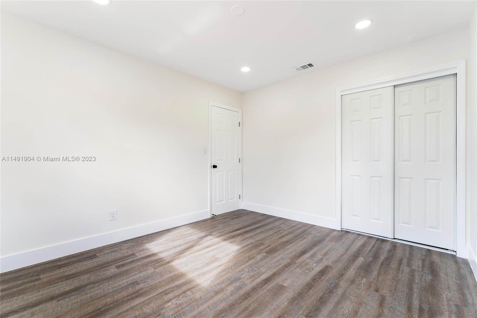 3254 Lincoln Street Hollywood, FL 33021 - Photo 25 of 27 a view of room with wooden floor