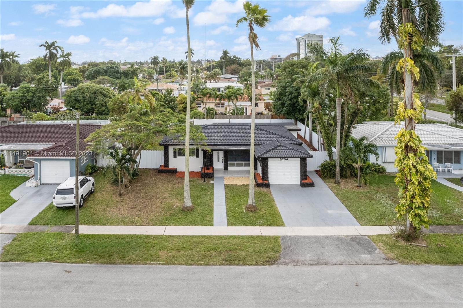 3254 Lincoln Street Hollywood, FL 33021 - Photo 4 of 27 an aerial view of a house with a yard