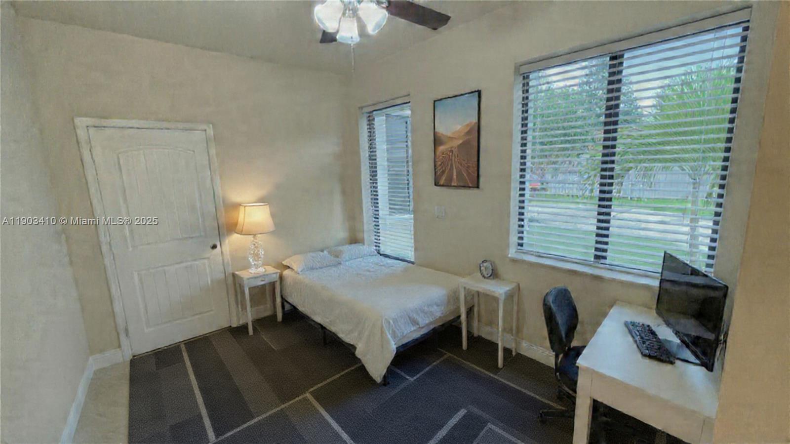 3301 Southwest 139th Avenue, Unit 3301 Miramar, FL 33027 - Photo 11 of 44 a bedroom with a bed and a window