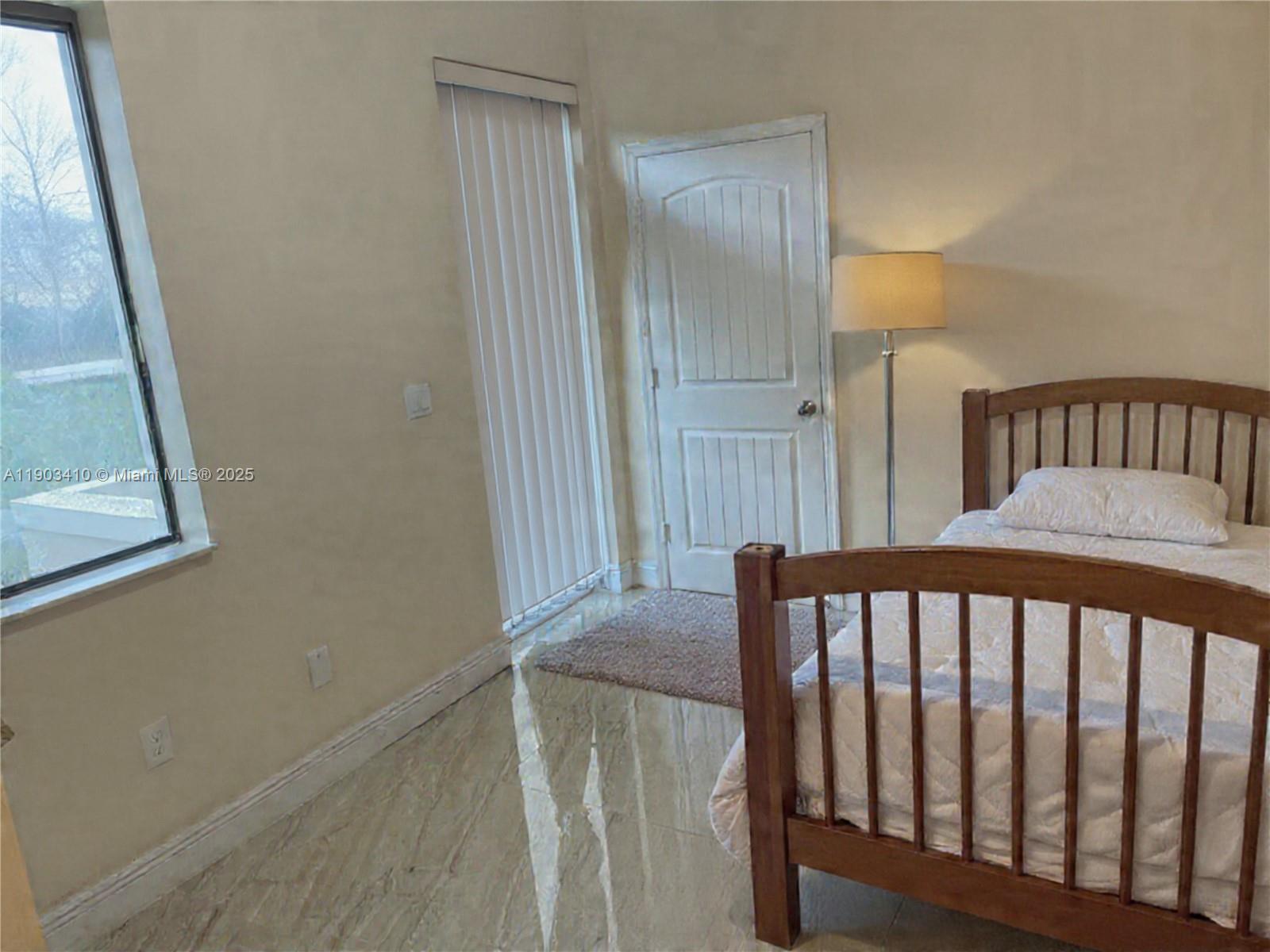 3301 Southwest 139th Avenue, Unit 3301 Miramar, FL 33027 - Photo 13 of 44 a view of a balcony with wooden floor