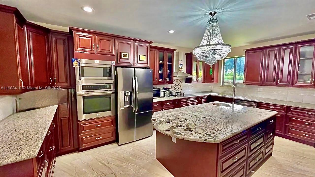 3301 Southwest 139th Avenue, Unit 3301 Miramar, FL 33027 - Photo 16 of 44 kitchen, wood and granite