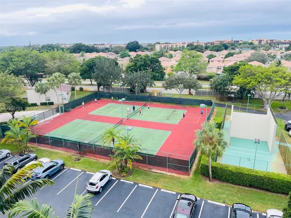 an outdoor space with furniture and umbrella