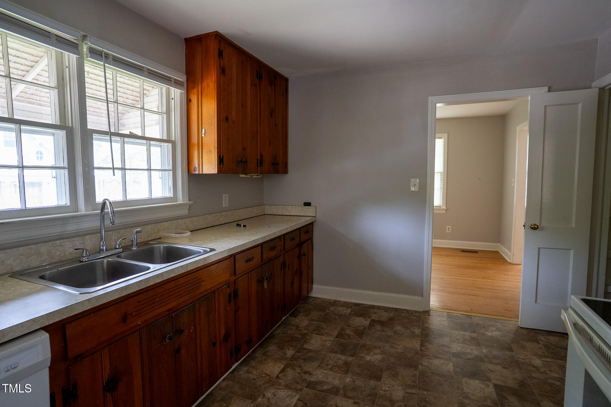 2100 Breeze Road Raleigh, NC 27608 - Photo 9 of 21 a kitchen with a sink and a window