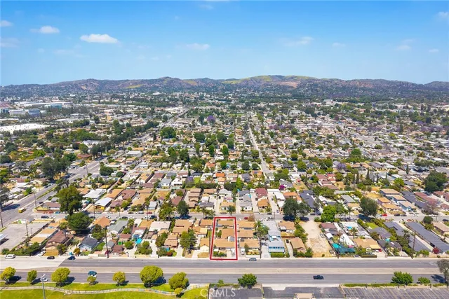 an aerial view of residential houses with outdoor space