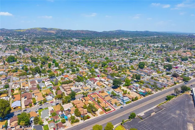 an aerial view of a residential apartment building with a swimming pool