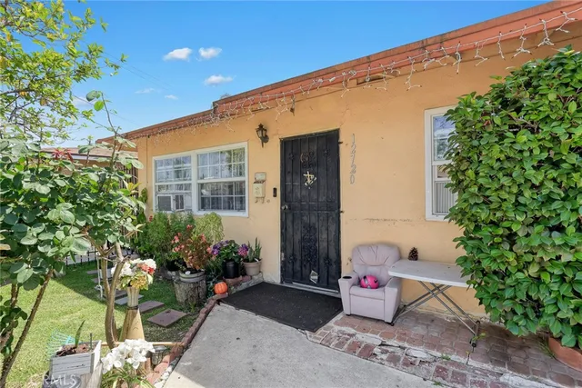 a front view of a house with an outdoor space