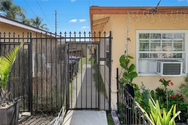 a couple of flower plants in front of building