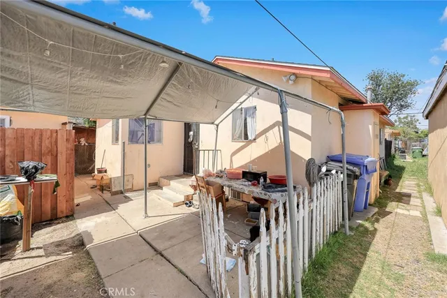 an aerial view of a house with a yard and lake view
