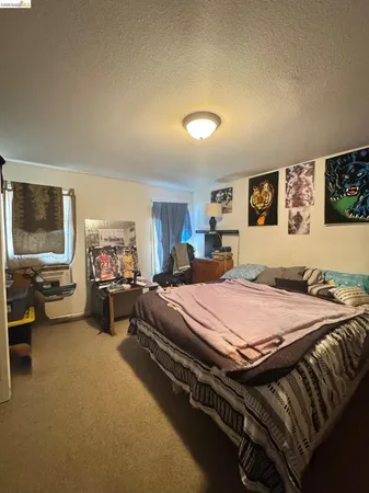 a bed room with furniture and a flat screen tv