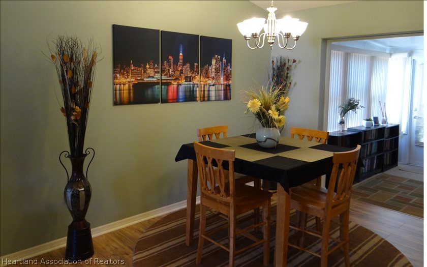 4219 Mandarin Road Sebring, FL 33875 - Photo 4 of 23 a view of a dining room with furniture and chandelier