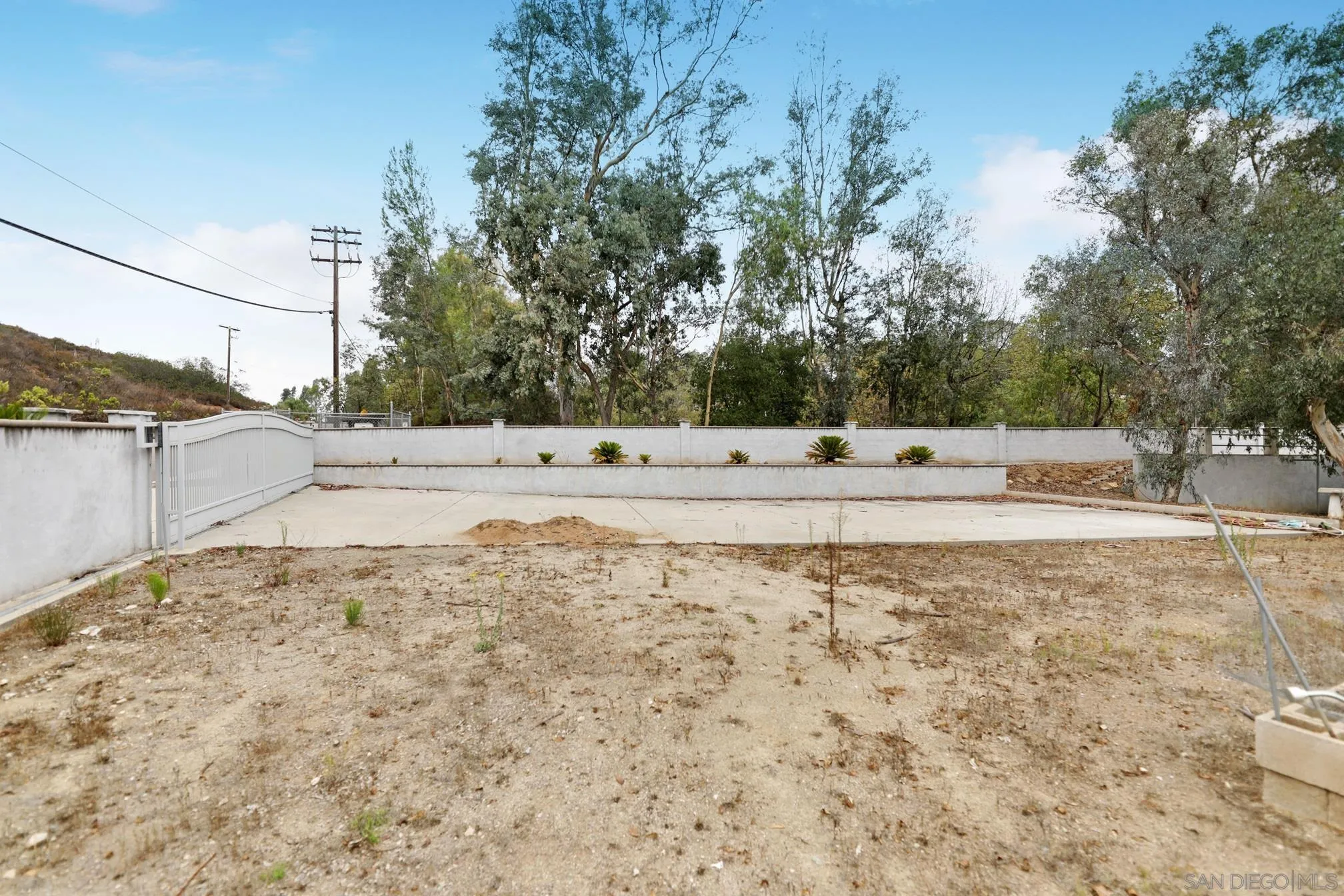 15130 Rios Canyon Road El Cajon, CA 92021 - Photo 54 of 59 a view of a yard with trees in the background