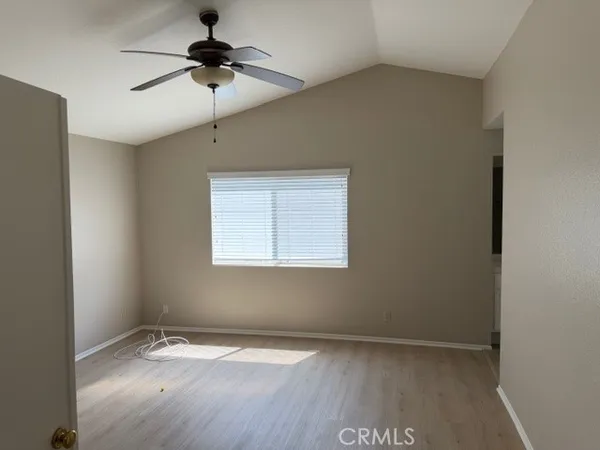 a spacious bathroom with a tub sink and mirror