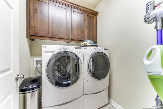 a view of an outdoor dining space with a table and chairs