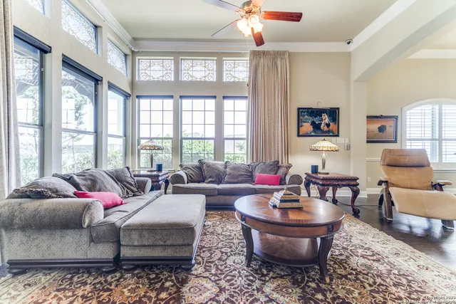 a living room with furniture and a large window