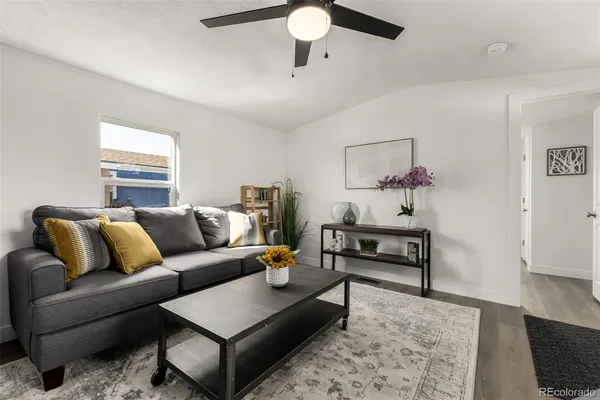 a living room with furniture and a rug