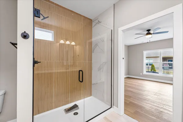 a bathroom with a shower and a sink