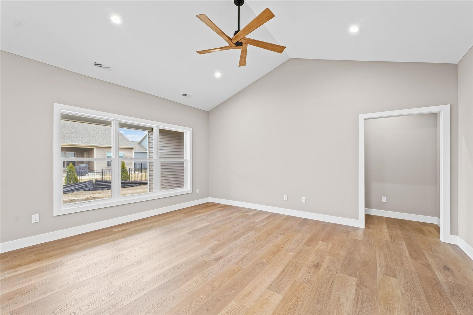 3902 Bay Circle Champaign, IL 61822 - Photo 5 of 29 wooden floor in an empty room with a window