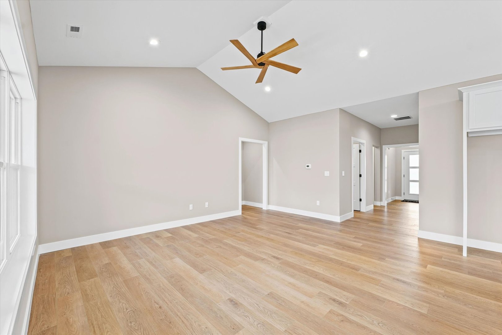 3902 Bay Circle Champaign, IL 61822 - Photo 6 of 29 an empty room with ceiling fan and wooden floor