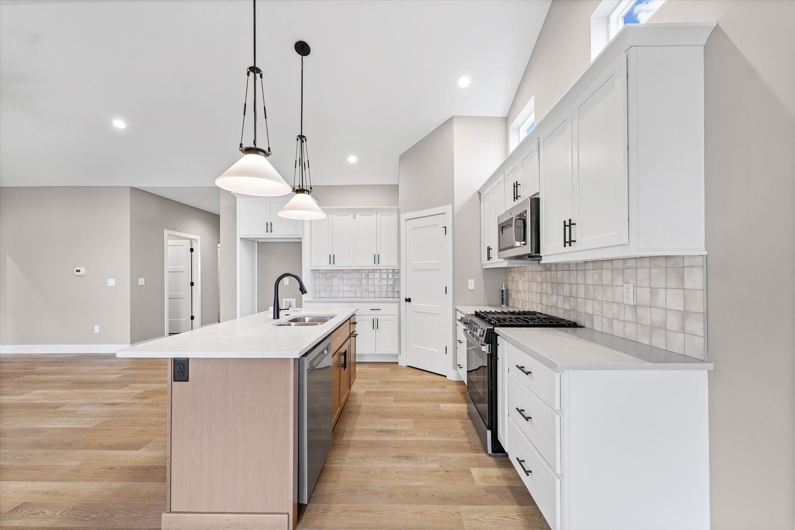 3902 Bay Circle Champaign, IL 61822 - Photo 9 of 29 a large kitchen with granite countertop a sink and a stove