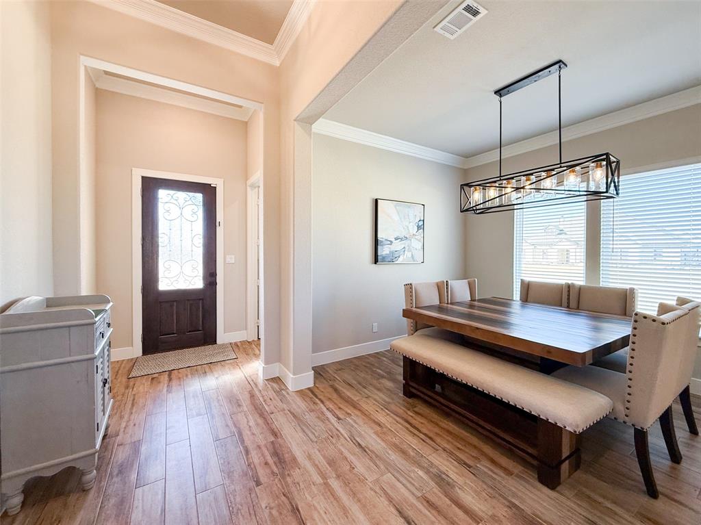 12116 Magma Court Krum, TX 76249 - Photo 2 of 30 a living room with furniture and a wooden floor