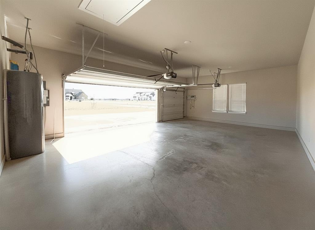 12116 Magma Court Krum, TX 76249 - Photo 25 of 30 a view of a kitchen with a dishwasher and a refrigerator