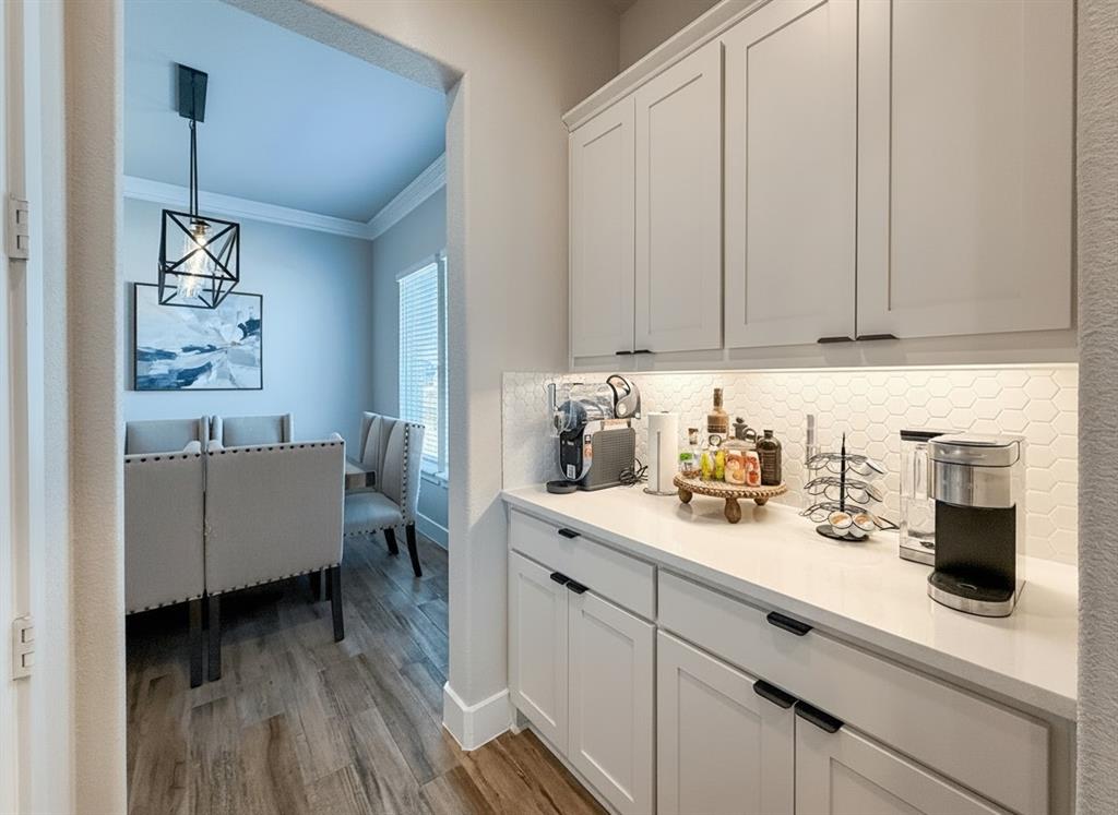 12116 Magma Court Krum, TX 76249 - Photo 6 of 30 a kitchen with a sink and cabinets