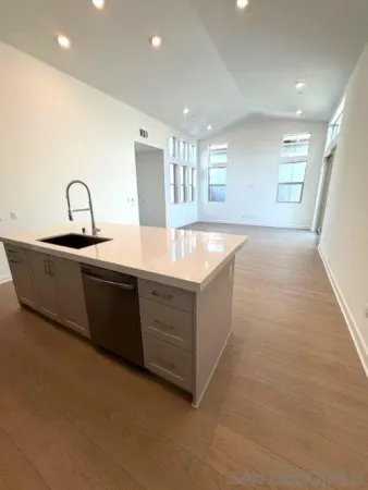 a view of a kitchen with a sink