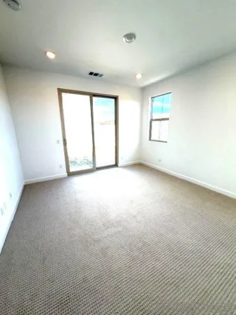 a view of a kitchen from the hallway
