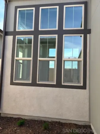 a view of backyard of the house