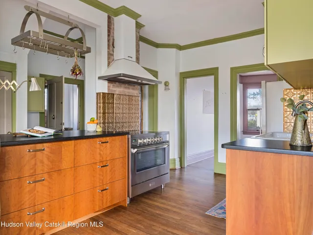 a kitchen with stainless steel appliances granite countertop a sink and cabinets
