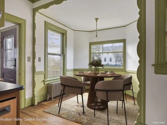 a dining room with furniture and window