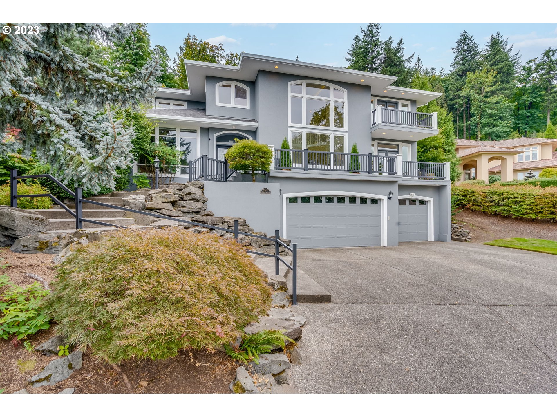 a view of house with outdoor space and sitting area