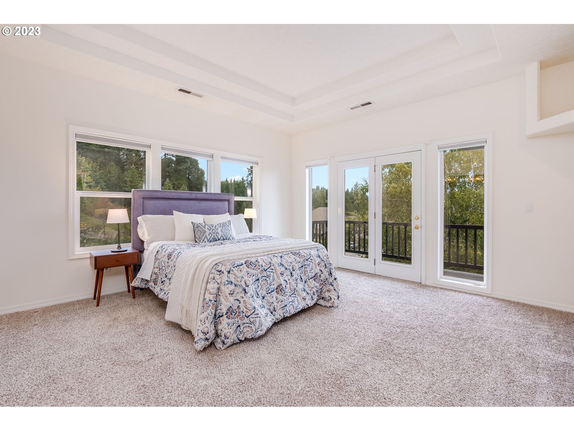2842 Southeast Morlan Place Gresham, OR 97080 - Photo 18 of 46 a bedroom with a large bed and a large window