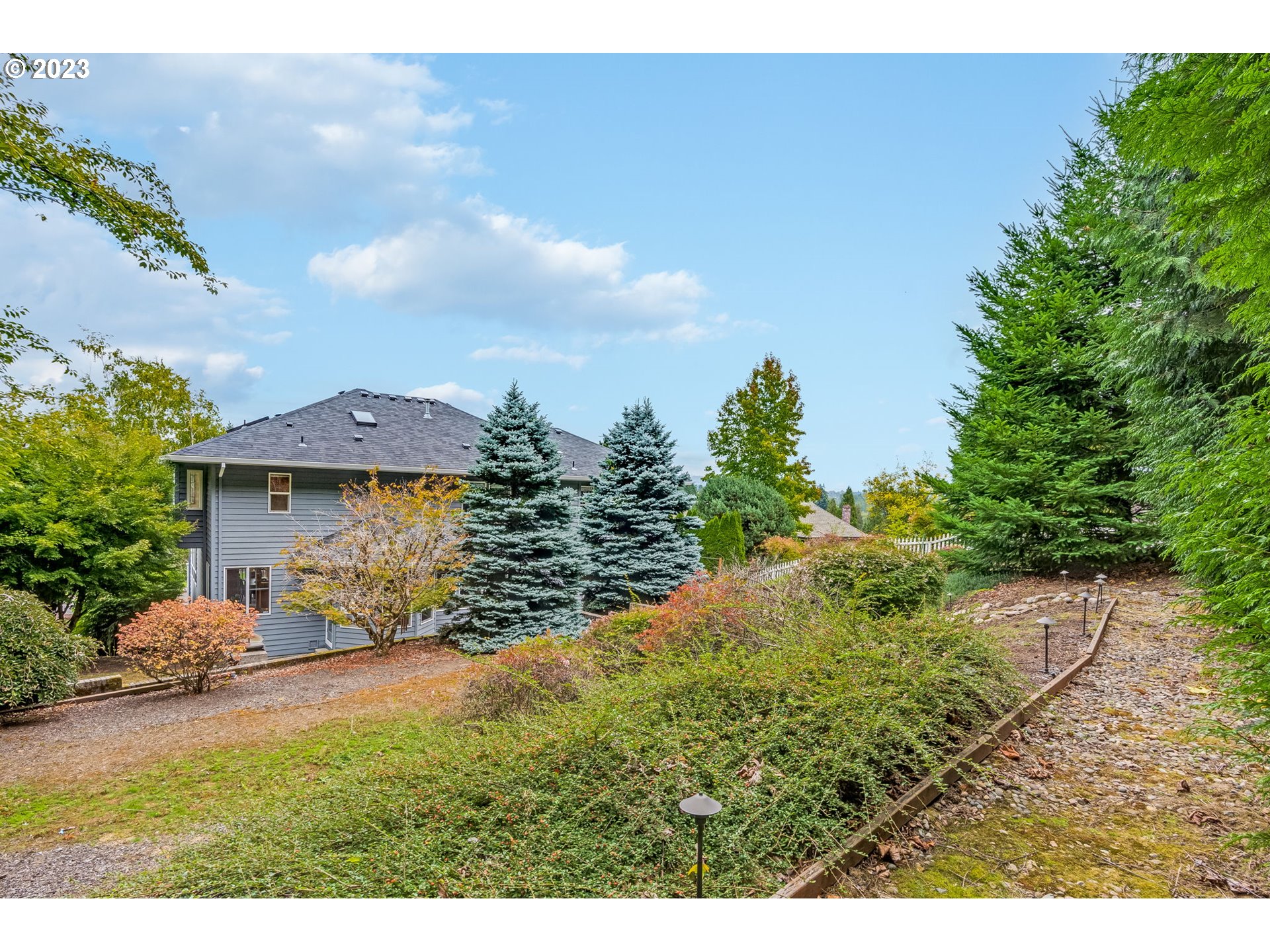 2842 Southeast Morlan Place Gresham, OR 97080 - Photo 43 of 46 a view of a house with a yard
