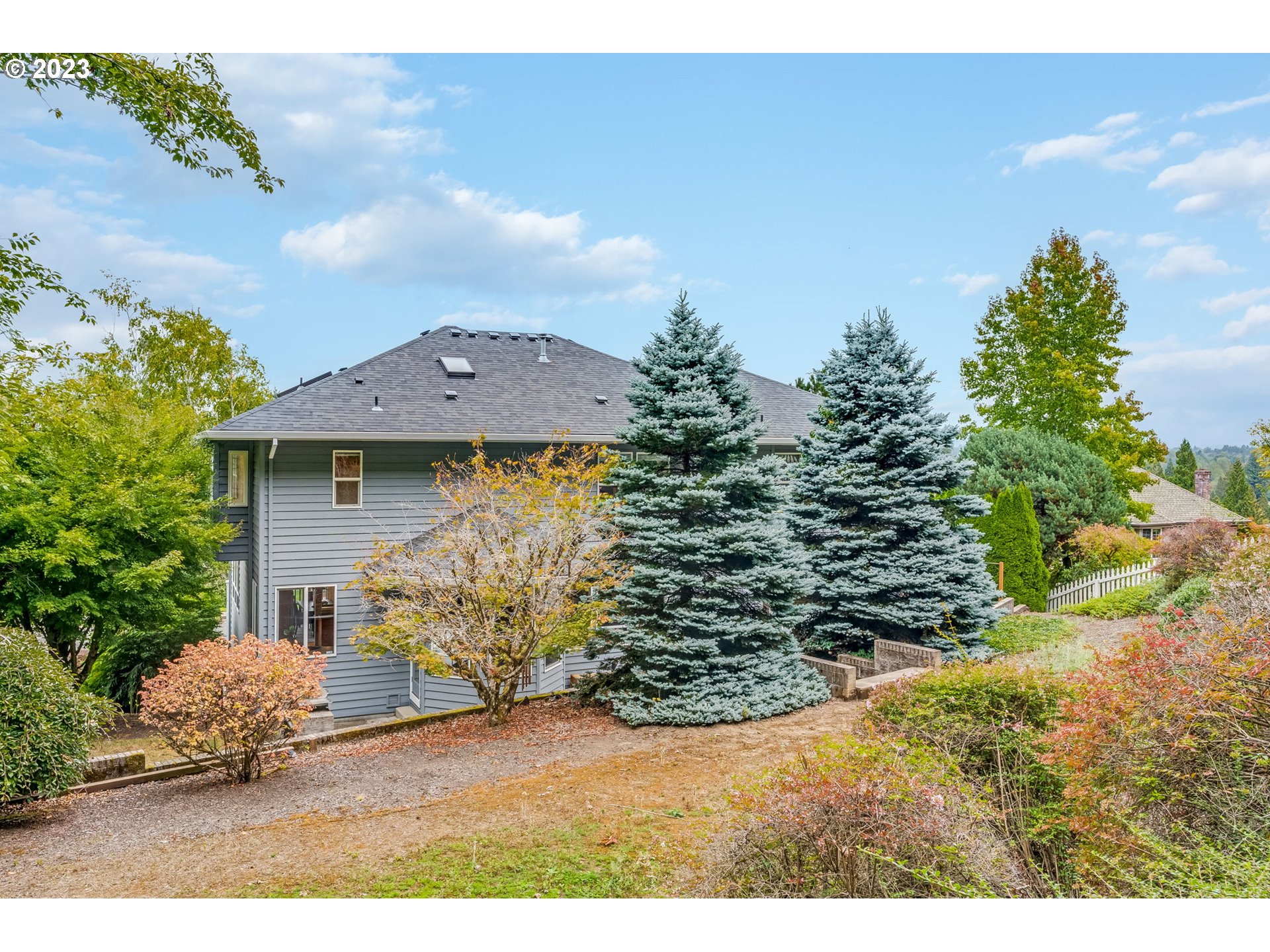 2842 Southeast Morlan Place Gresham, OR 97080 - Photo 44 of 46 a view of a house with a yard and garage