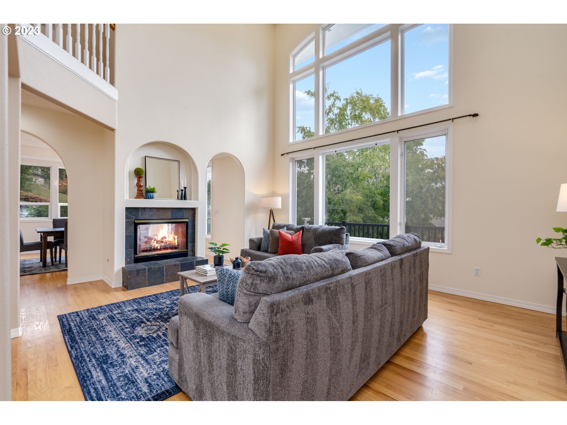 2842 Southeast Morlan Place Gresham, OR 97080 - Photo 6 of 46 a living room with furniture a window and a fireplace