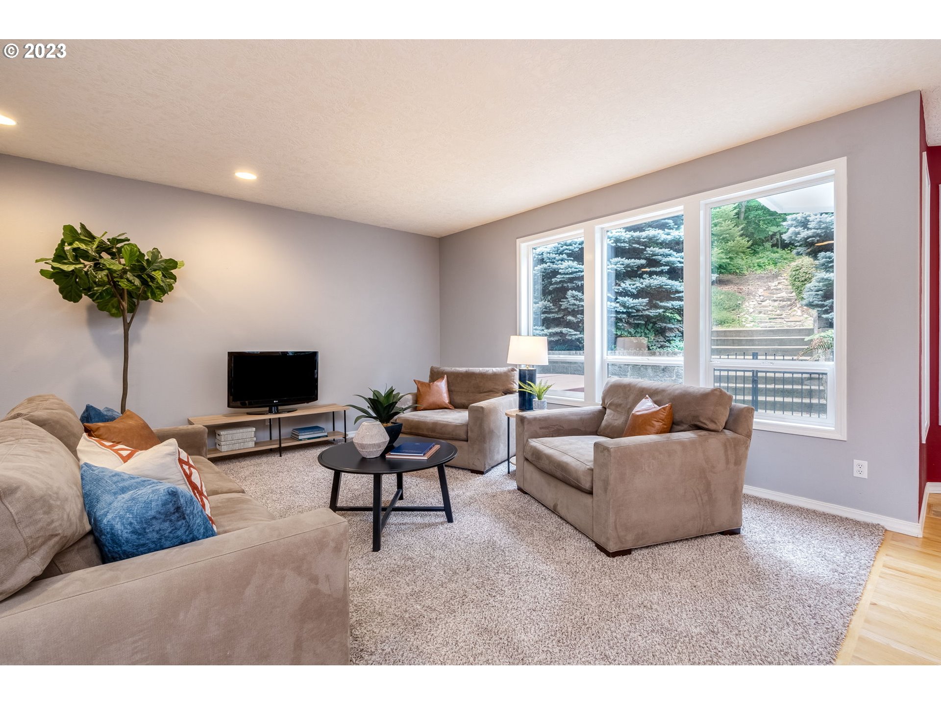 2842 Southeast Morlan Place Gresham, OR 97080 - Photo 9 of 46 a living room with furniture and a flat screen tv