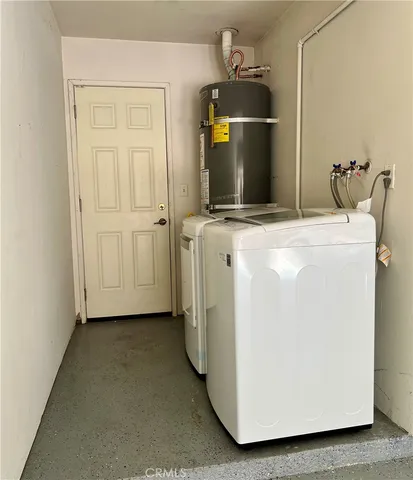 a view of a storage & utility room with washer and dryer