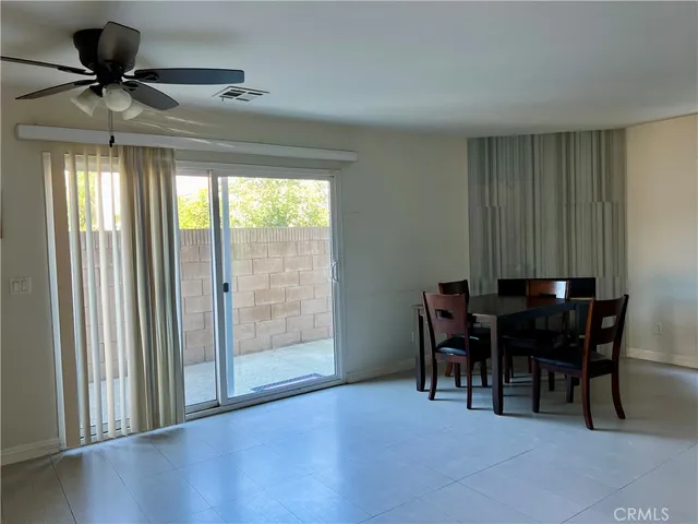 a view of a livingroom with furniture and a window