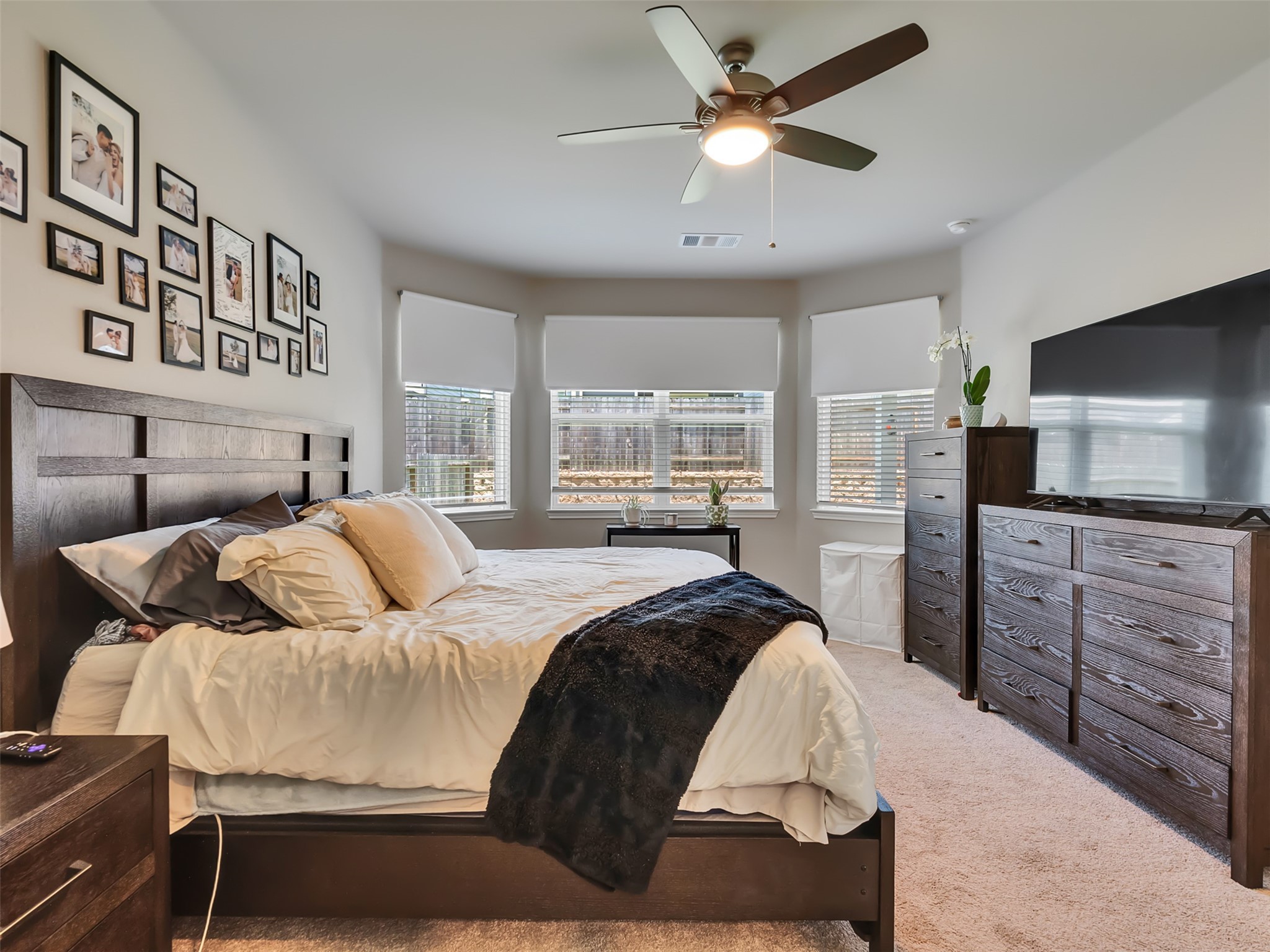 2416 Bluefish Court Conroe, TX 77384 - Photo 22 of 45 a bedroom with a bed and a flat screen tv