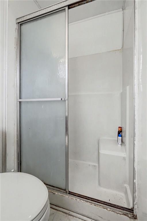 1408 Prospect Road Chickamauga, GA 30707 - Photo 15 of 27 a bathroom with a bathtub and a shower