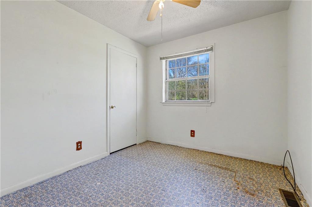 1408 Prospect Road Chickamauga, GA 30707 - Photo 19 of 27 a view of room with window and ceiling fan