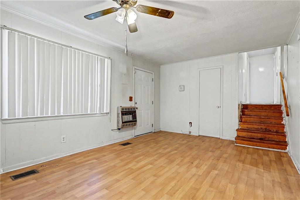 1408 Prospect Road Chickamauga, GA 30707 - Photo 4 of 27 a view of empty room with wooden floor and fan