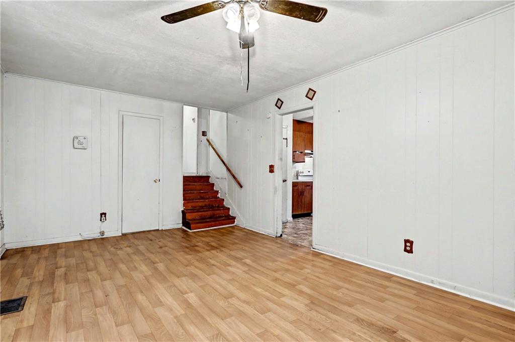 1408 Prospect Road Chickamauga, GA 30707 - Photo 5 of 27 a view of an empty room with wooden floor