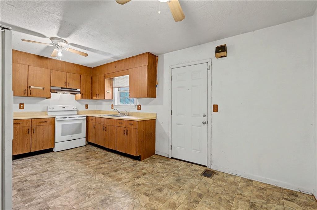 1408 Prospect Road Chickamauga, GA 30707 - Photo 10 of 27 a utility room with cabinets washer and dryer