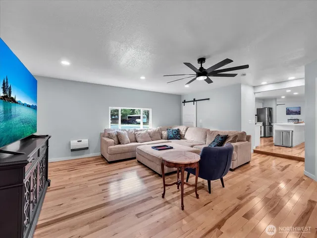 a living room with furniture and a large window