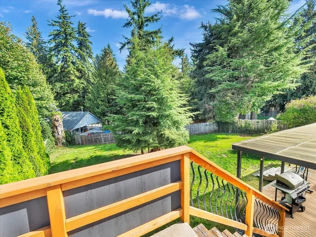 a aerial view of a house with a yard