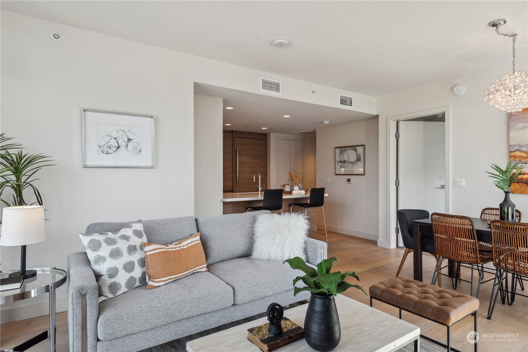 583 Battery Street, Unit 506N Seattle, WA 98121 - Photo 11 of 36 a living room with furniture and a potted plant